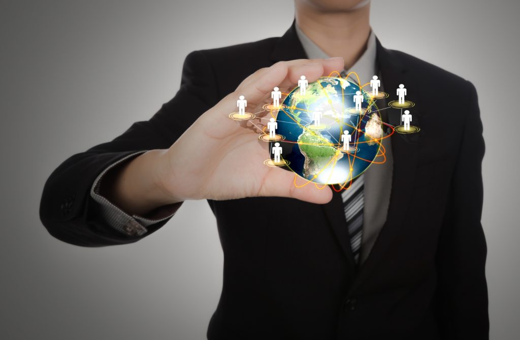 Unlocking Success: 10 Vital Reasons Cultural Competence is Essential for Global Careers 6 businessman holding planet earth with people symbols