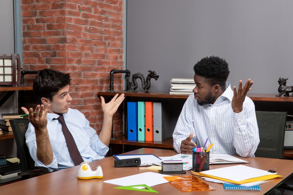 Unlock Your Success: 10 Transformative Job Satisfaction And Advantages 13 front view two businessmen formal wear sitting table with office stuffs discussing