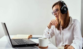 woman-in-headphones-listen-audio-course-at-laptop-2022-12-16-12-48-47-utc.jpg