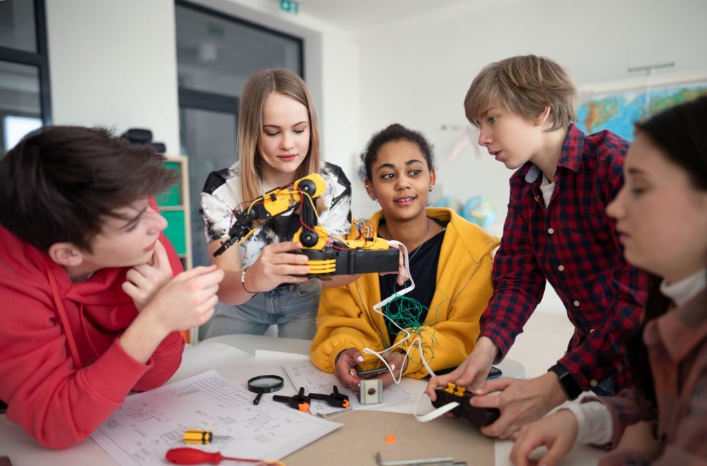 group of students building and programming electri 2026 03 10 04 02 58 utc