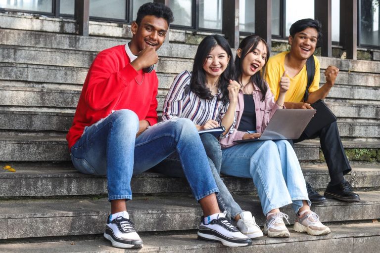 young multiethnic college celebrating success whil 2026 01 07 06 34 07 utc